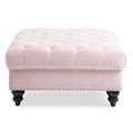 Grand pouf capitonné en velours avec détails cloutés