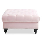 Grand pouf capitonné en velours avec détails cloutés