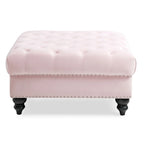 Grand pouf capitonné en velours avec détails cloutés