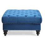 Grand pouf capitonné en velours avec détails cloutés