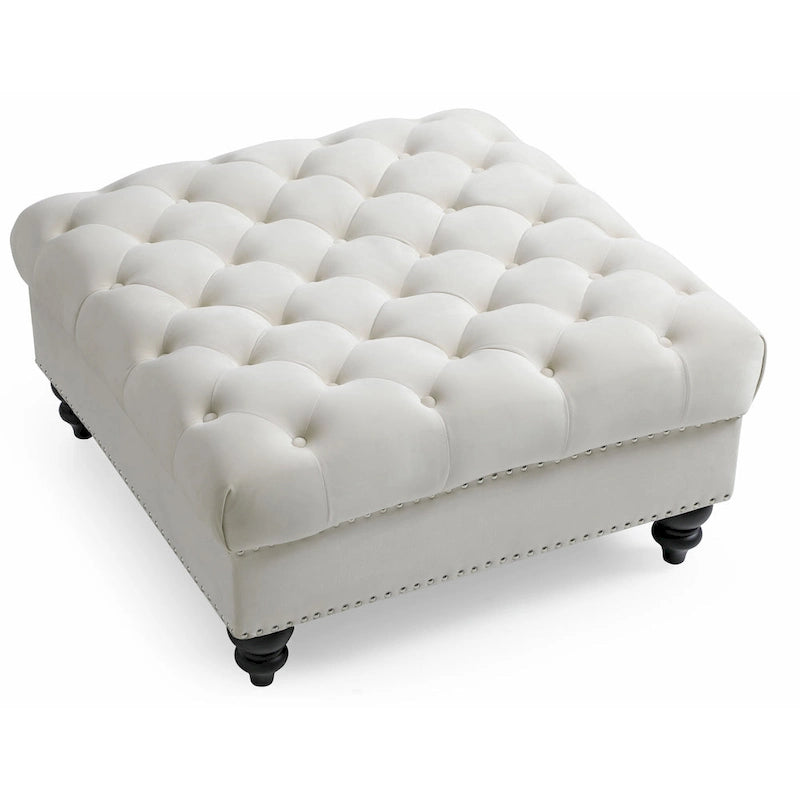 Grand pouf capitonné en velours avec détails cloutés